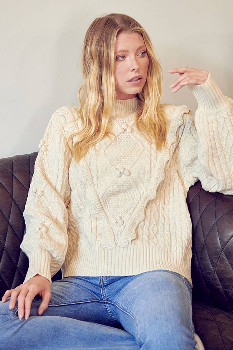 MOCK NECK CABLE KNIT PULLOVER WITH POM