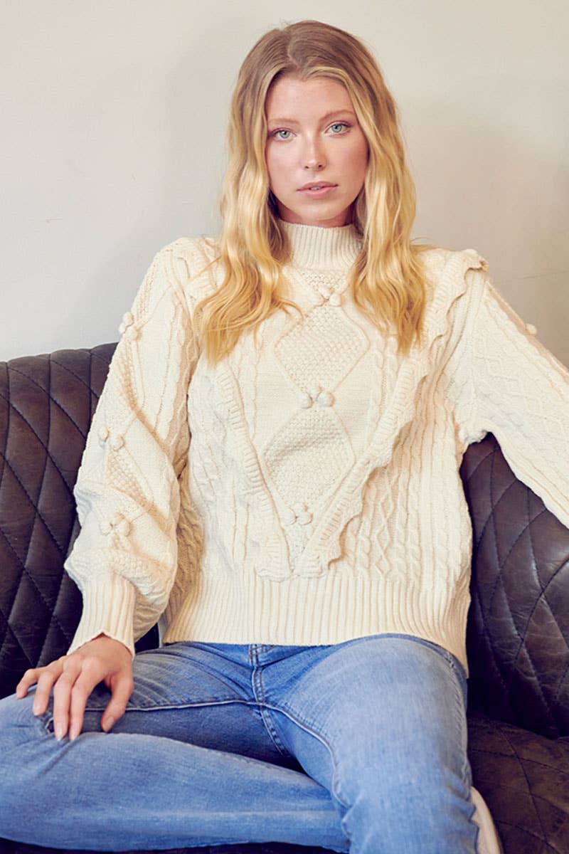 MOCK NECK CABLE KNIT PULLOVER WITH POM