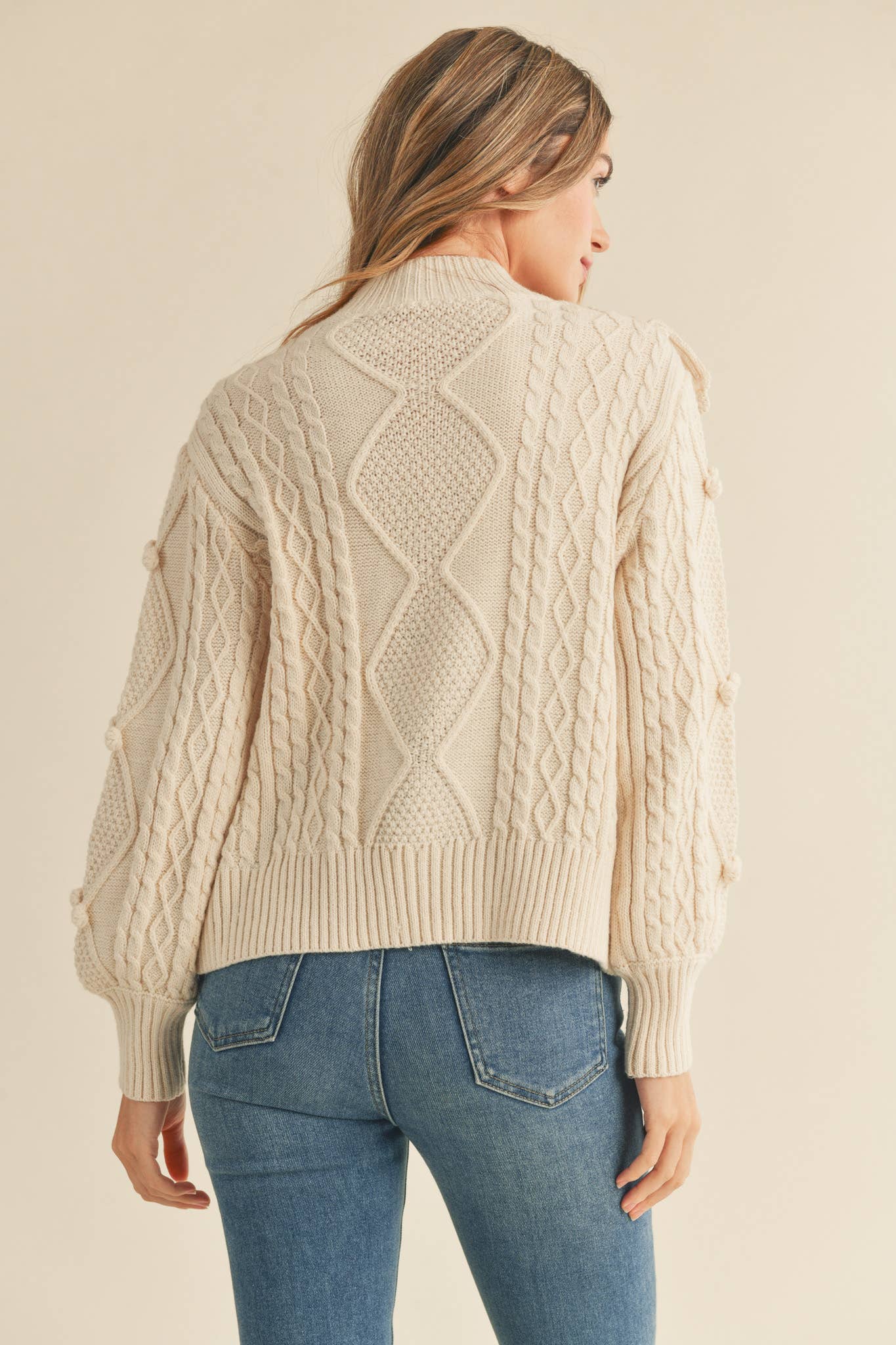 MOCK NECK CABLE KNIT PULLOVER WITH POM