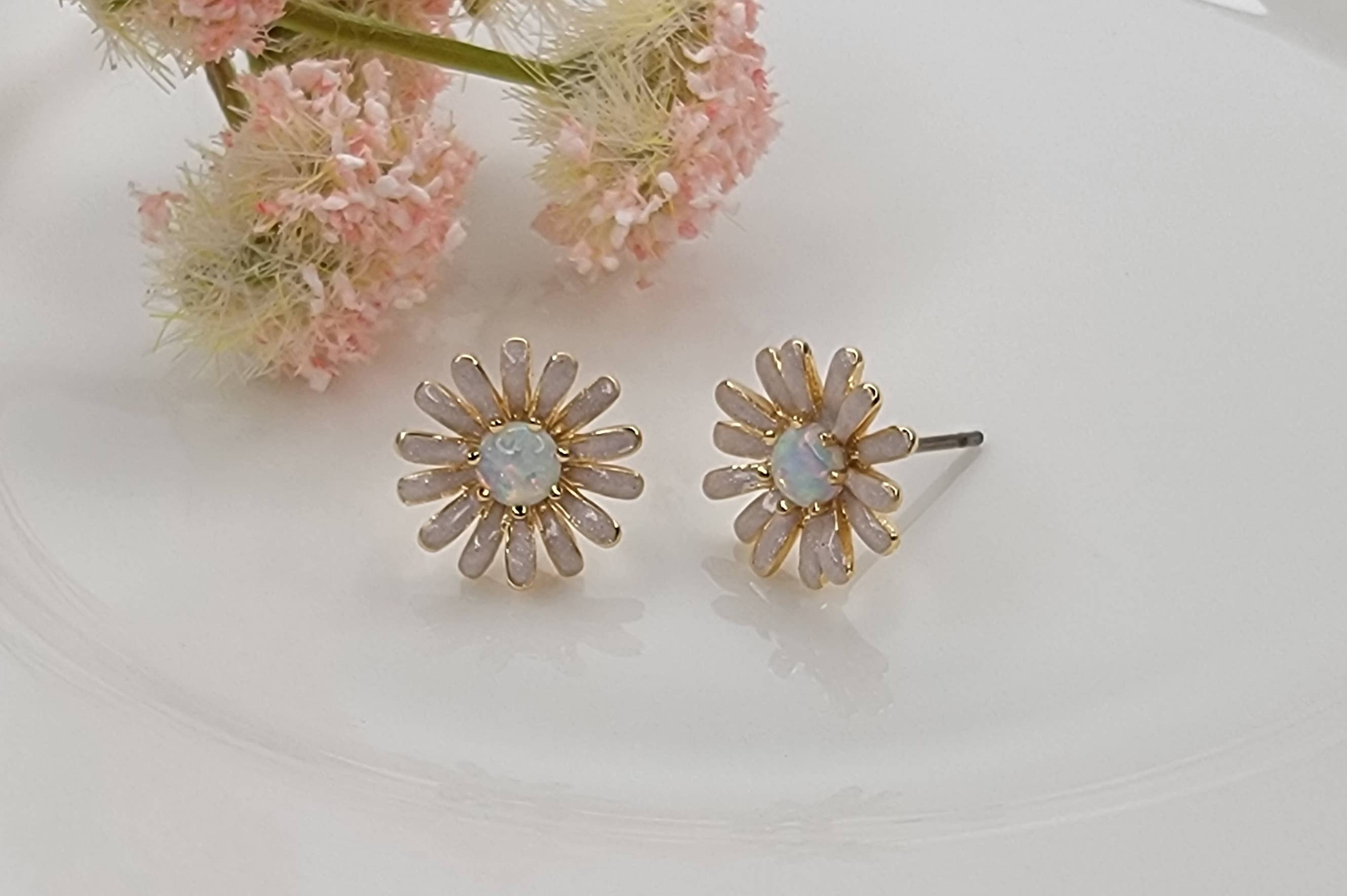 DAISY FLOWER WITH OPAL STONE ACCENT POST EARRINGS.
